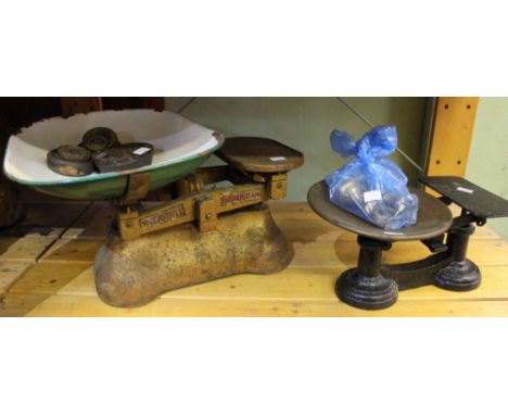 Two pairs of vintage weighing scales with weights
