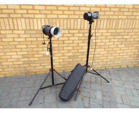 Photographic equipment - an Elinchrom D-Lite 4it and an Elinchrome D-Lite 2it (lighting units) each with tripod stands in sof