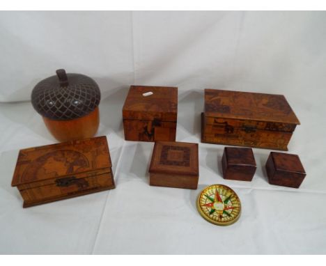 Six wooden trinket boxes, a dome paperweight depicting a compass and similar