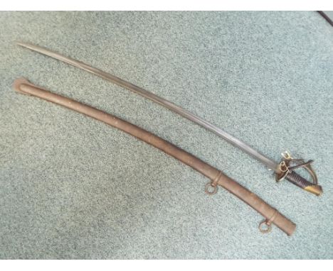 A 19th century French model 1822 light cavalry sabre, number 22, with curved steel double fullered blade, length 92cm, brass 