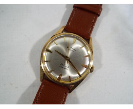 Rotary - a gentleman's wristwatch, the yellow metal case presumed 9ct, circular dial with baton markers, sweep centre seconds