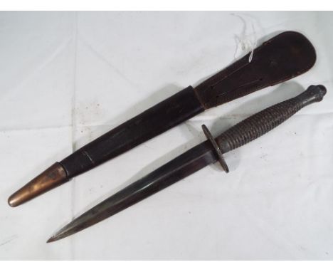 A WW2 (World War Two) sterile 3rd Pattern Army Commando Fairbairn Sykes FS Fighting Knife original leather sheath.  Est £100 