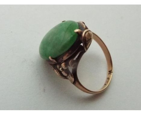 A lady's Asian yellow metal ring, presumed 9 carat yellow gold and set with jade, size K, approx weight 3.41 gm (all in) - Es