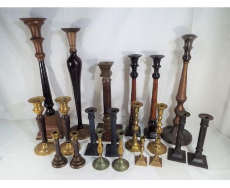 Twenty candle sticks predominantly pairs to include brass, Empire style and similar largest candle stick approx 54cm (h)