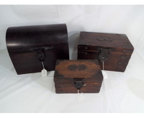 Three small wooden storage boxes one in the form of a tea caddy (3) Est £30 - £50