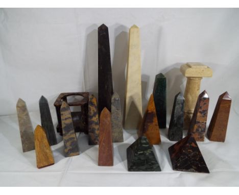 Eighteen decorative carved hard stone items comprising obelisks, pyramids, pillar and similar, height of largest item approx 
