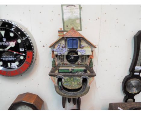 A novelty clock the 'Memories of Steam Flying Scotsman Clock' by the Bradford Group of Companies with certificate of authenti
