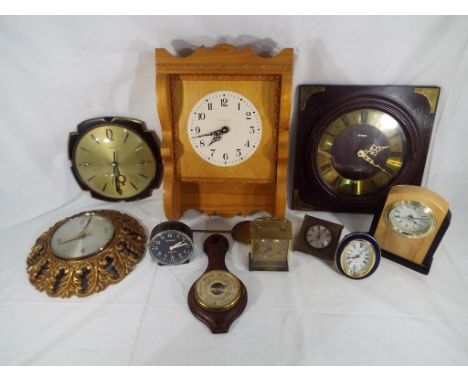 Eight clocks comprising wall clocks, mantel clocks, alarm clock, carriage clock to include Metamec, Smiths, Westclox and simi