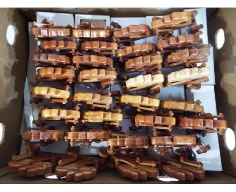 A good lot of 36 wooden toys to include twenty secret compartment trinket boxes depicting the moon, boxed and sixteen push-al