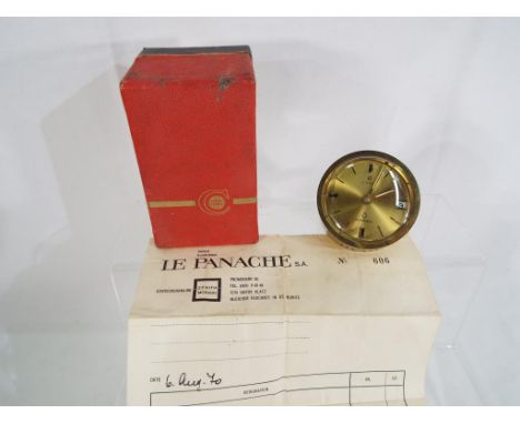 A Cyma Sonomatic alarm clock, 17 jewelled mechanical movement with original box and bill of sale dated 1970 from Le Panache o