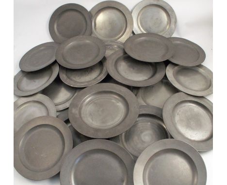 A set of eight Antique pewter plates, with touch marks, diameter 9.25ins, together with a set of four Antique pewter plates, 