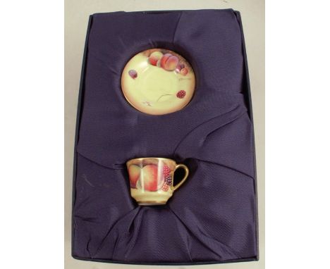 A Royal Worcester miniature cup and saucer, decorated with fruit to a mossy background by Bowman, boxedCondition Report:  Goo