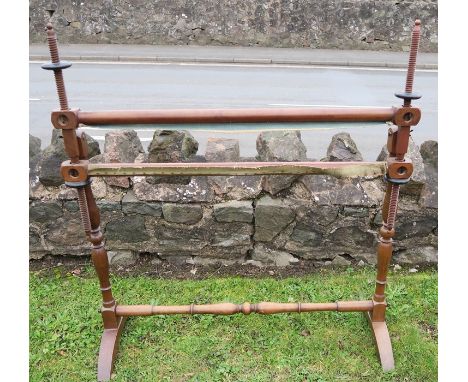 A mahogany tapestry frame on stand