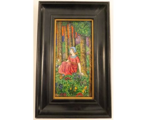 A rectangular enamel plaque, of a girl in the Pre-Raphaelite style, seated in a wood, 7ins x 3.5ins