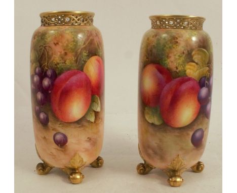 A Royal Worcester spill vase, decorated half round with hand painted fruit by Townsend, to a pierced git neck and raised on f