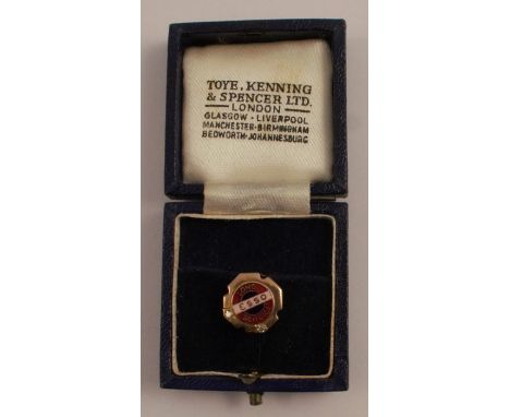 A 9 carat gold Esso 'Long Service' pin, set with two diamonds, the words 'Long Service' in red enamel and 'Esso' in pink enam