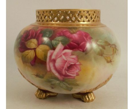 A Royal Worcester spherical shaped vase, decorated with roses by Harper, having a pierced neck and raised on three paw feet, 