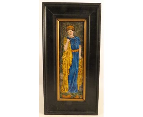A rectangular enamel plaque, of a girl in a long blue dress with amber cloak, 9ins x 3ins