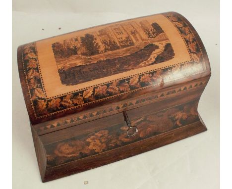 A 19th century dome topped Tunbridgeware caddy, the cover decorated with a view of a castle surrounded by a border of flowers