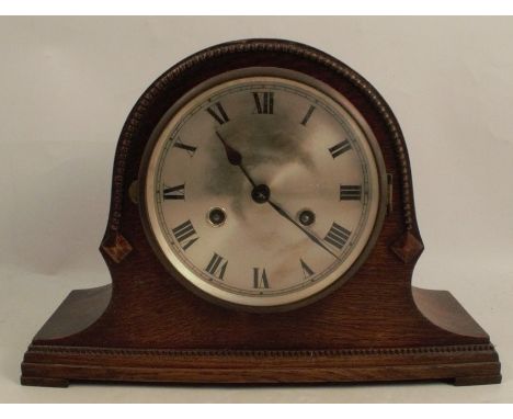 An oak cased mantel clock, with silver dial, the striking movement stamped D.R.G.M, height 9ins