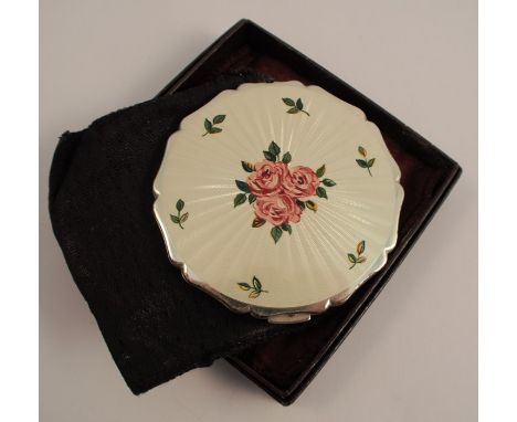 A Stratton powder compact, with an enamel foliate cover, and a circular vanity mirror