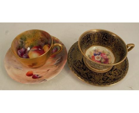 A Royal Worcester cup and saucer, decorated with flowers by Philips to an ornate gilt border, together with a Royal Worcester
