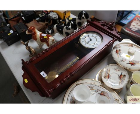 A modern three hole wall clock