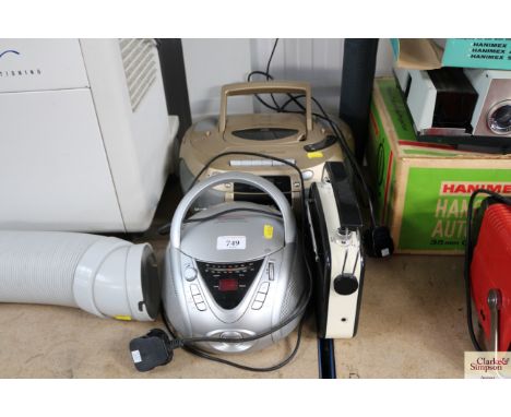A portable CD player; a Bush portable CD player and a Bush portable radio