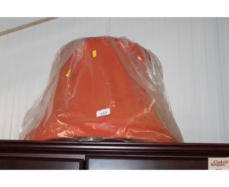 A large orange light shade