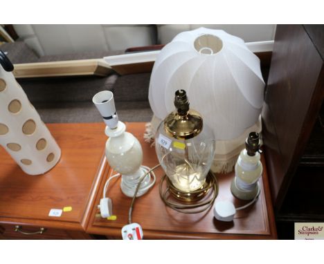A glass table lamp and shade together with two alabaster table lamps and shades