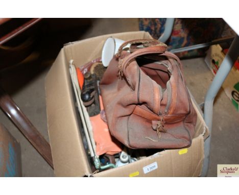 A box containing  various tools, brushes, nails etc.