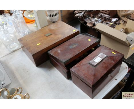 A 19th Century writing box together with a 19th Century brass bound work box and a 19th Century mahogany sarcophagus shaped t