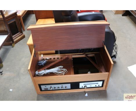 A teak record player cabinet lacking turntable, containing Rogers Ravensbrook stereo tuner and a Rogers Ravensbrook stereo