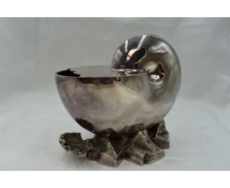 A silver plated spoon warmer modelled as a nautilus shell on rock base, with hinged lid and scallop shell handle, Army &amp; 