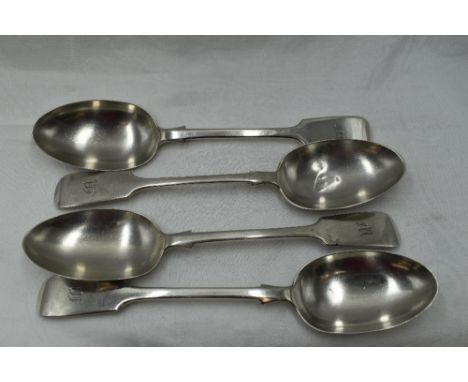 Four Edwardian silver table spoons of fiddle back form bearing monogram M to terminals, London 1902/06, Josiah Williams &amp;