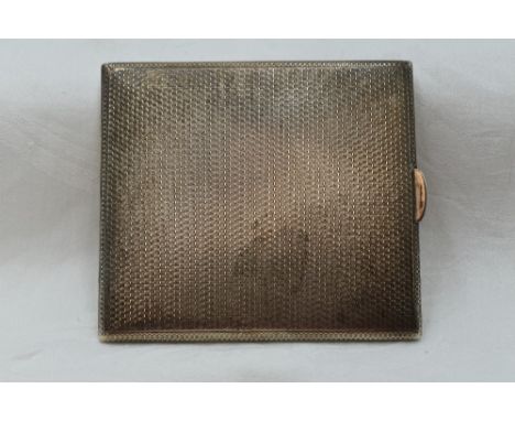 A silver cigarette case having engine turned chequered decoration, Birmingham 1927, D Bros, approx 147g
Condition Report&nbsp