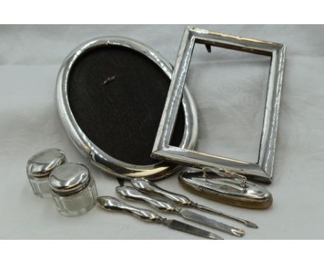 A selection of HM silver including two photograph frames of plain form, both AF and a selection of manicure tools including n