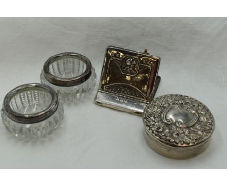 Two cut glass salts having HM silver collars, a white metal circular trinket box stamped sterling having moulded push on lid 