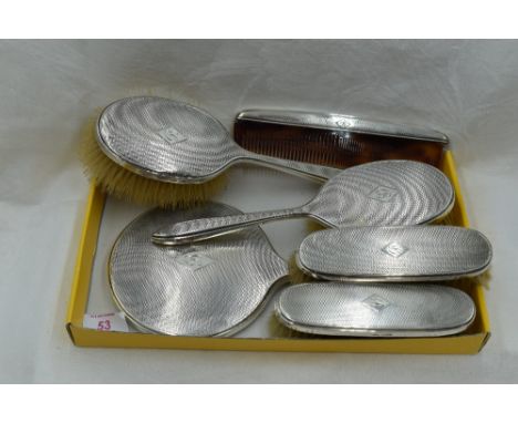 A six piece silver dressing table set having engine turned decoration and bearing monogram B to cartouche, Sheffield 1933, Wa