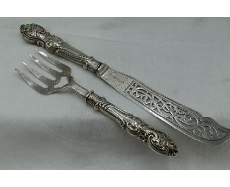 A pair of Victorian silver fish servers having moulded handles and pierced and engraved blades, Sheffield 1846, Aaron Hadfiel