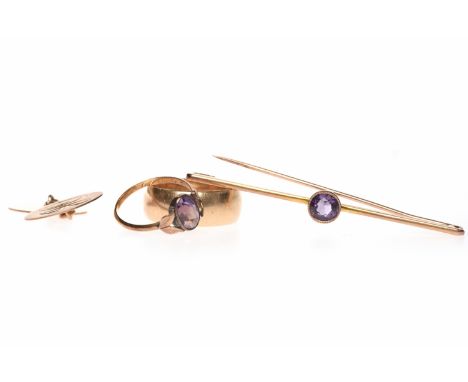 EARLY TWENTIETH CENTURY AMETHYST DRESS RINGwith a single oval amethyst 8.2mm long within a millegrain edged collet setting, o