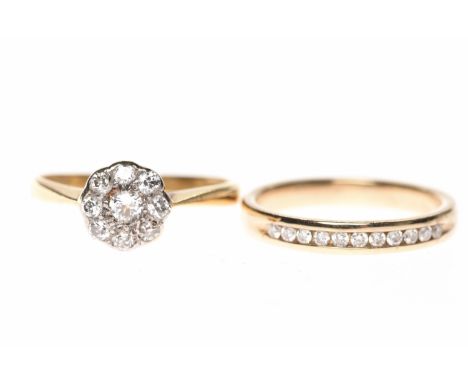 DIAMOND FLORAL CLUSTER RINGset with round brilliant cut stones totalling approximately 0.24 carats, hallmarks indistinct, siz