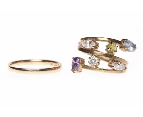 NINE CARAT GOLD GEM SET RINGthe shank split into three gold bars and connected by various gems including amethyst, size K, 4.