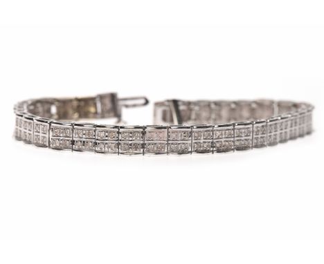 NINE CARAT WHITE GOLD DIAMOND SET BRACELETformed by rectangular links each set with four round diamonds, 17cm long, 12.5g