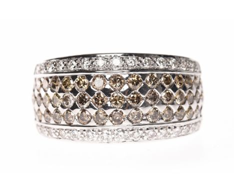 FOURTEEN CARAT WHITE GOLD DIAMOND SET BANDthe broad band with a broad central panel set with cognac coloured diamonds flanked