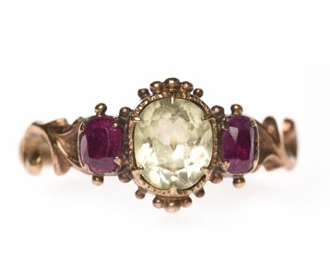 EARLY VICTORIAN RUBY AND PASTE DRESS RINGthe central oval paste 6.5mm long and flanked by two rectangular step cut rubies, on