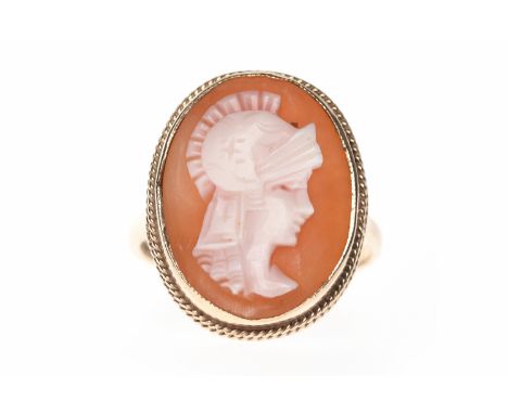 NINE CARAT GOLD CAMEO SET RINGset with an oval shell cameo carved to depict a figure with wearing a helmet facing right, 20mm