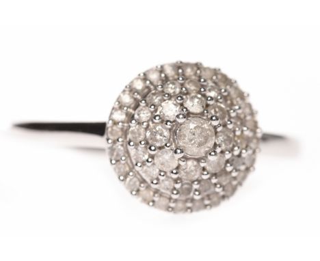 NINE CARAT WHITE GOLD DIAMOND CLUSTER RINGthe round bezel with tiers of round diamonds, size R, 3.3g, with accompanying Jewel