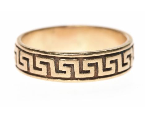 NINE CARAT GOLD RINGwith engraved Greek key motif, 5.8mm wide, size R, 4.1g