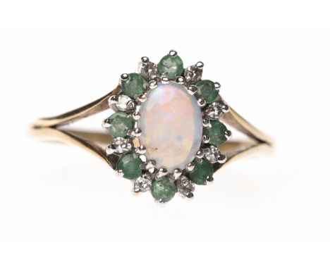 OPAL, EMERALD AND DIAMOND DRESS RINGset with a central oval opal surrounded by alternating round diamonds and emeralds, in ni